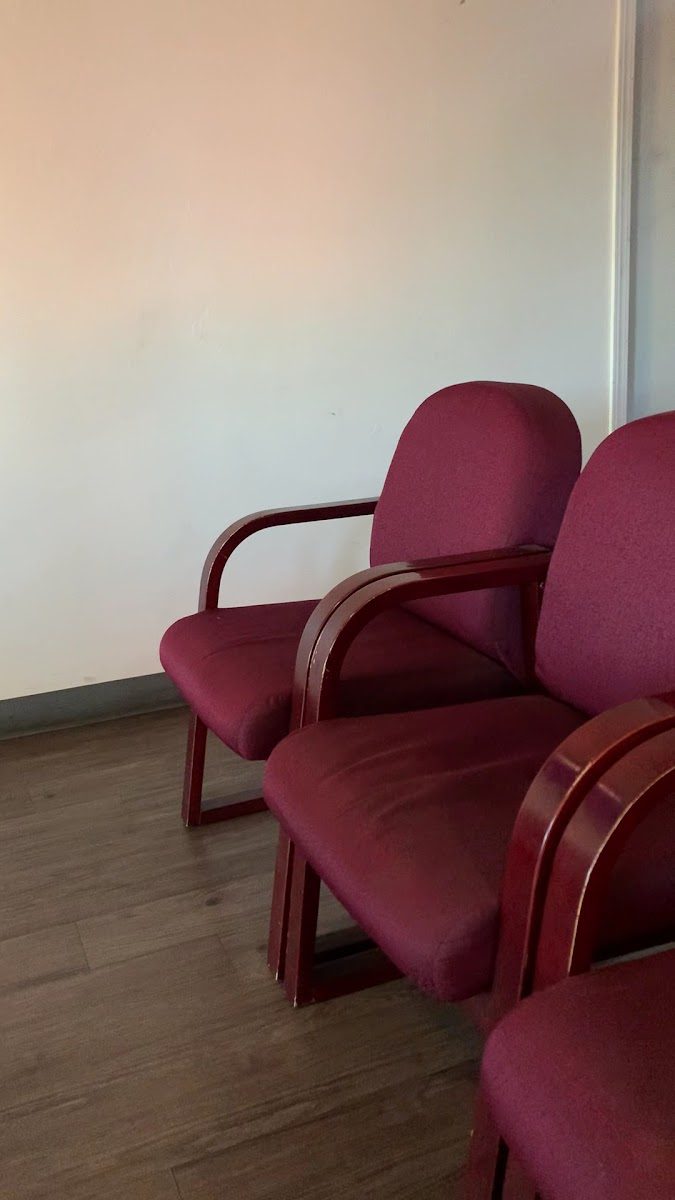 Burgundy upholstered chairs in the waiting room